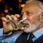 man drinking bourbon