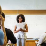 Black girl giving class presentation