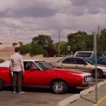 Lalo waiting outside car