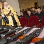 Russian Orthodox priest blesses rifles