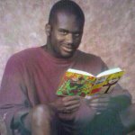 Black guy holding the chainsaw man manga