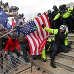 Jan. 6 hypocrite traitor beats police officer with American flag