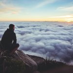 man looking at clouds