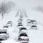 Snow storm stranded cars highway