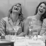 Women laughing at a table