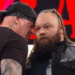 Undertaker whispering to Bray Wyatt at Raw XXX