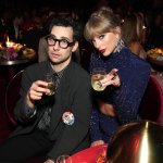 Taylor Swift and Jack Antonoff pointing