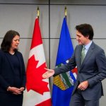 Danielle Smith Justin Trudeau handshake