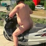 Naked man on scooter