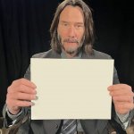 Keanu Reeves holding paper