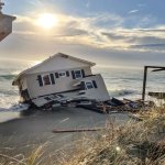 House Sinking Into Ocean