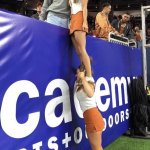 Cheerleader Standing on Shoulder