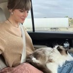 Taylor Swift and cat in car