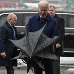 Joe Biden struggles with umbrella