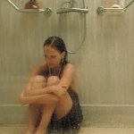 Woman crying in shower