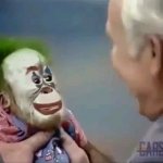man laughing at monkey clown