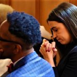 AOC pretending to pray at afro-american funeral