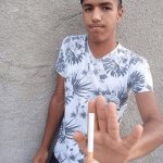 Guy Refusing Cigarette While Holding One