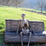skeleton on a bench