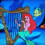 ariel playing the harp