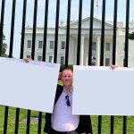A person is holding two white boards in his hands template