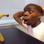 Shocked black guy staring into a banana meme
