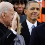 Obama smiling at Biden