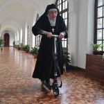 nun on a scooter