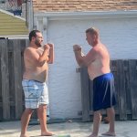 Shirtless men fighting