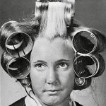 Young woman with curlers