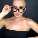 sexy bald girl with glasses