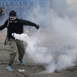 Tennis Racket VS Tear Gas