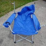 Blue folding chair, wrecked