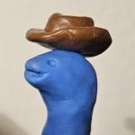 Clay dinosaur cowboy