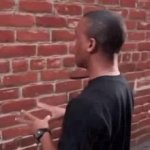 Black guy talking to a Wall GIF Template