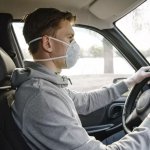 Man Wearing Mask in Car