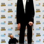 the tallest and shortest man in the world | FIRST GRADE ME TRYING TO GET THE ATTENTION OF AN 8TH GRADER | image tagged in the tallest and shortest man in the world | made w/ Imgflip meme maker