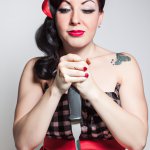 Pinup holding bloody knife
