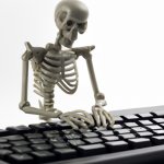 skeleton dying at computer