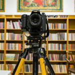 Large camera on tripod in library