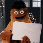 Gritty Holding a sign