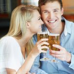 Happy couple drinking beer