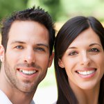 COUPLE SMILING WITH TEETH SHOWING