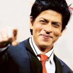 Shah Rukh Khan smiling and pointing