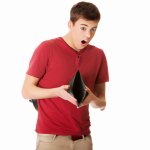 shocked or surprised student holding an empty wallet or looking