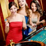 3 Women Gambling at Roulette Wheel