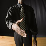 a man giving a trade offer in a dark room