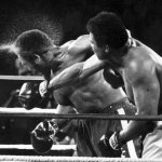 Muhammad Ali punches someone.
