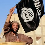 isis solider smiling with banner