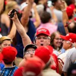 Red MAGA hat mob